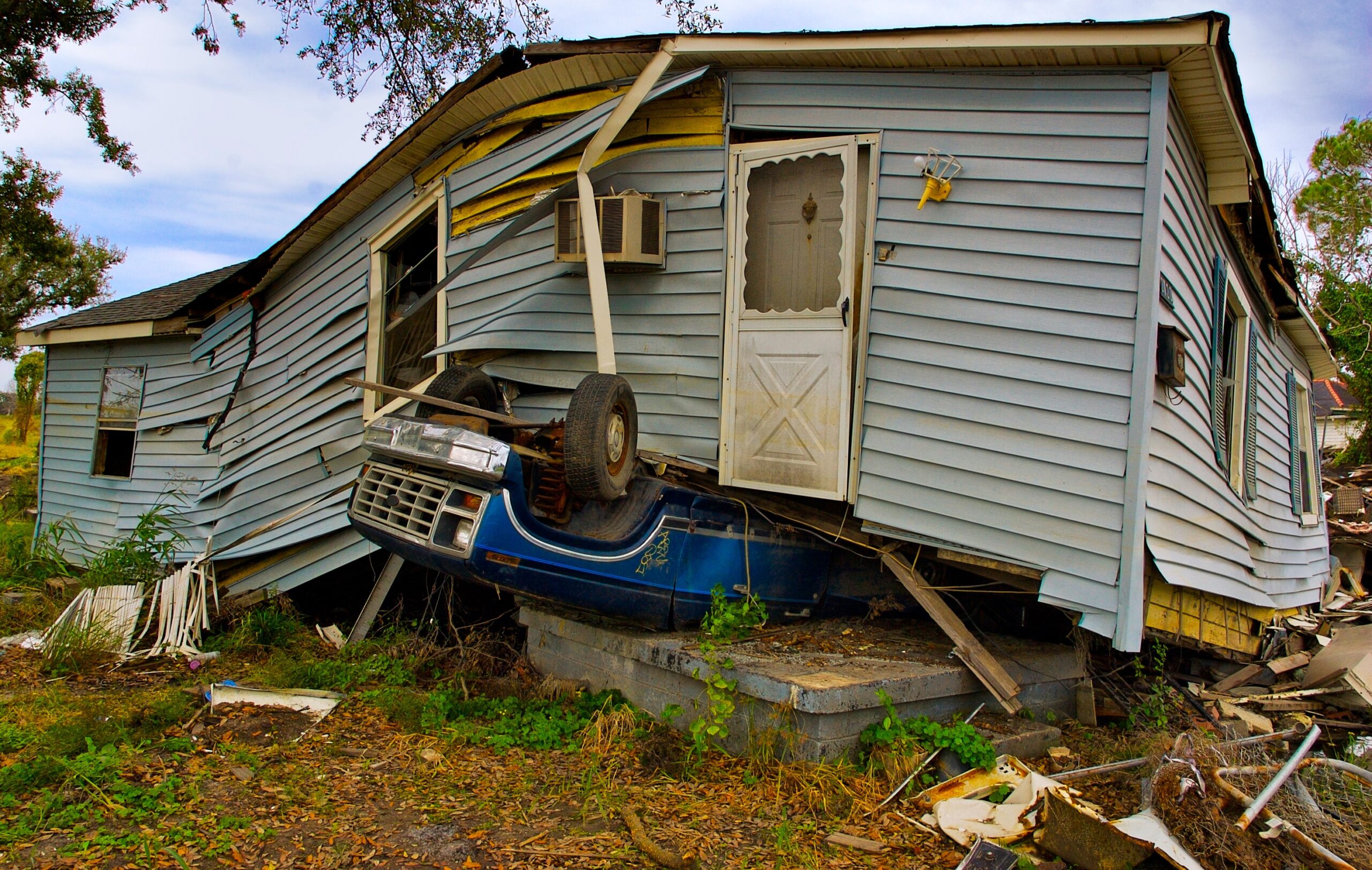 a mobile home that is severely damaged by a hurricane