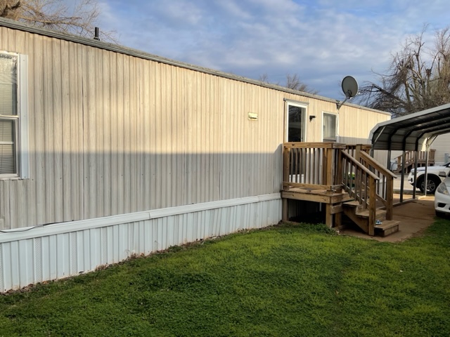 a photo of a mobile home situated in a mobile home park